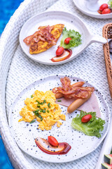 Breakfast in swimming pool, floating breakfast in villa resort. relaxing in calm pool water, healthy breakfast and tropical fruit.