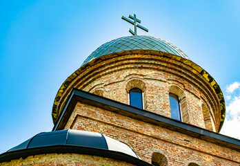 Christian church cross in high steeple tower for prayer