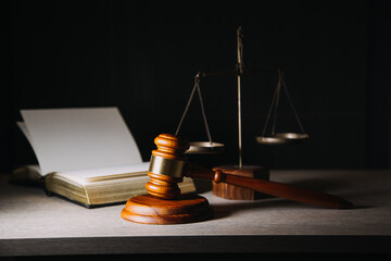 Justice and law concept.Male judge in a courtroom with the gavel, working with, computer and...
