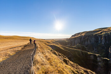 Hiking along a canyon on a sunny day