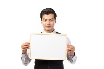 Portrait of happy smiling young businessman showing blank signboard with copyspace for text isolated on white background.