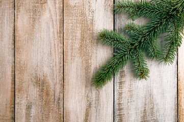 Pine tree branches, xmas symbol year celebration. Green fir branches on a wooden background. Christmas. Winter. Flat lay