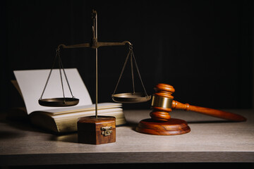 Justice and law concept.Male judge in a courtroom with the gavel, working with, computer and...
