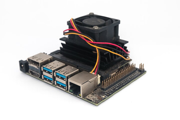 A mini pc with a dc fan on the gpu.