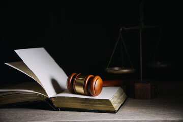 Justice and law concept.Male judge in a courtroom with the gavel, working with, computer and...