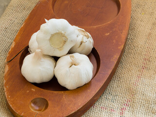 garlic in a wooden box , used for health purposes by people