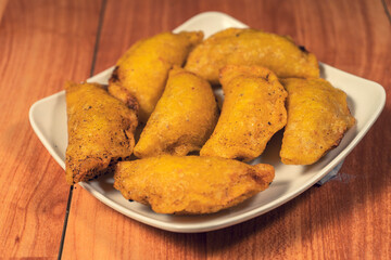 Colombian empanada with spicy sauce