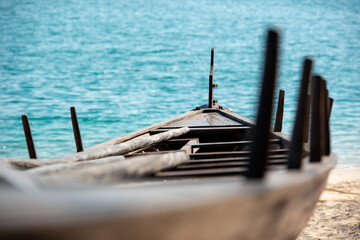 into the sea, traditional rowing boat waiting to be brought into the water 