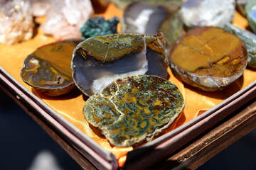 Raw unpolished gold, silver and copper nuggets isolated on background, mineral stone close-up.