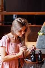 Woman in spa salon chooses the smell of aromatherapy essential oil