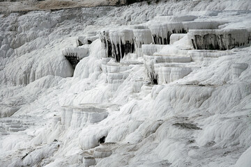 Fototapeta na wymiar View of natural travertine pools and terraces in Pamukkale. Cotton castle in southwestern Turkey