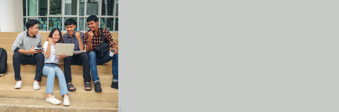 Group of Diversity Student talking and laughing together at asian college, working on laptop. Happy multi ethnic friend successfully completes thesis report and passed final exam--banner image