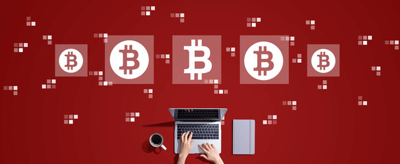 Bitcoin theme with person working with a laptop