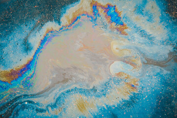 Traces and Stains of Oil or Gasoline on the Asphalt on the Road