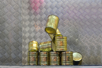 Falling tin can pyramid hit by a ball, throwing game at a carnival funfair or Christmas market,...
