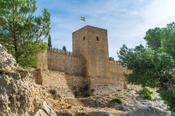 Fototapeta na wymiar Alcazaba de Antequera. old medieval castle. stone walls, towers, stone buildings. horizontally and vertically, sunlight, blue sky and clouds