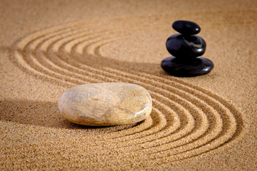 Fototapeta na wymiar textured sand and stone in Japanese zen garden