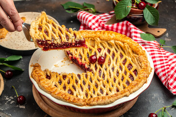 slice of cherry pie, Flaky Crust, piece on a plate and the whole homemade cherry pie, top view