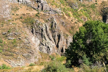 Sharp stone rocks on a slope in the Caucasian mountains.
