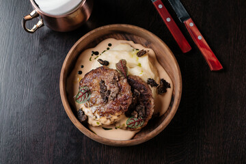 fried meat with mushrooms and sauce