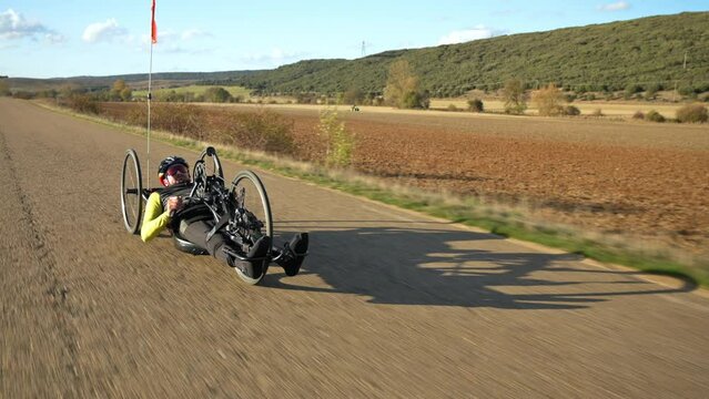 Athlete with disability training with His Handbike on a Track. High quality 4k footage