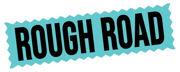 ROUGH ROAD text written on blue-black zig-zag stamp.