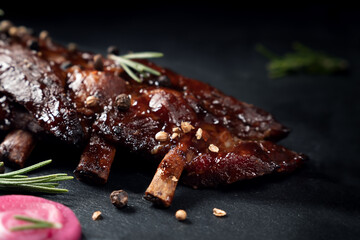 Pork grilled ribs on dark slate