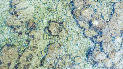 Rocky beach with blue sea at Cisterna Beach near Rovinj