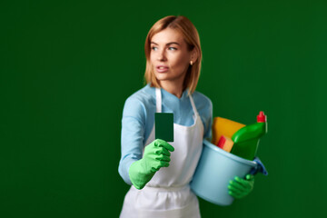 woman with bucket with cleaning supplies showing empty card