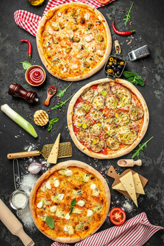 set of three different pizzas on a dark background, Fast food lunch, top view