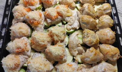 The second course is on a baking sheet. Lunch option. Chicken with cheese.
