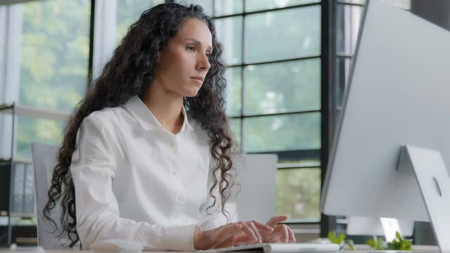 Focused serious tired businesswoman working in office on computer upset woman feeling frustrated due to problem and software error loss of important data unsaved information reads bad news by email