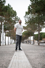Natural looking guy posing outdoors, wearing casual clothes