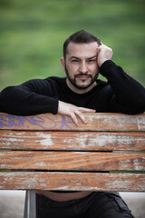 Natural looking guy posing outdoors, wearing casual clothes