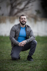 Obraz premium Natural looking guy posing outdoors, wearing casual clothes
