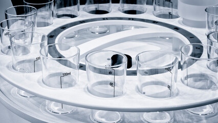 Medical or chemical background with laboratory equipment and liquids.