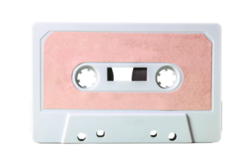 Isolated old vintage cassette tape (obsolete music technology from the 1980s, having a great comeback). White plastic body, empty pink label.
