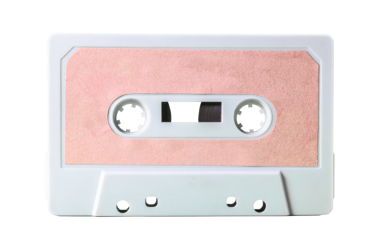 Isolated old vintage cassette tape (obsolete music technology from the 1980s, having a great comeback). White plastic body, empty pink label.
