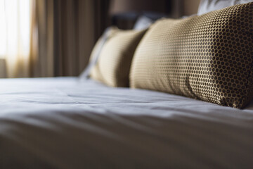 Close-up of pillows on bed in hotel room