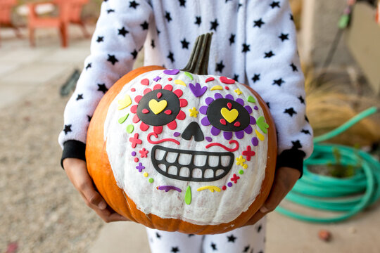 Close up of painted dia de los muertos pumpkin