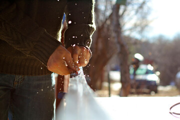 Man waxing skate skis