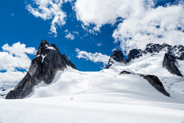 Person walking in mountains in snow