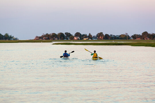 Kayakers on Essex River at Cox Reservation in Essex, Massachusetts