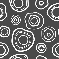 Seamless pattern with white shabby circles on grey background. Kaleidoscope wallpaper. Decorative hand drawn ornament. Vector illustration. Ethnic style print