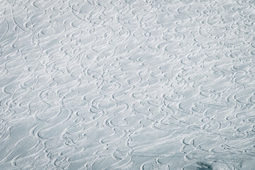 Slalom ski tracks cross each other on a steep, snowy ski slope. Mölltaler glacier, Flattach, Kärnten, Austria, Europe.