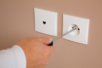 Electrician installing a socket