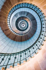 Fotobehang Trappen Spiral stairs and blue opaline inside the lighthouse  © Willy Mobilo