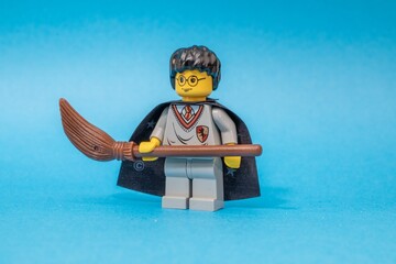 Fototapeta premium Lego Harry Potter kit 4711 with a broom isolated on blue background