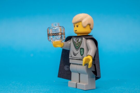 Lego Draco Malfoy with a Remembrall from Harry Potter kit 4711 isolated on  blue background Stock Photo | Adobe Stock