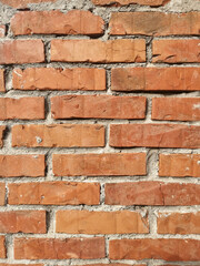 The wall made of an old brown bricks